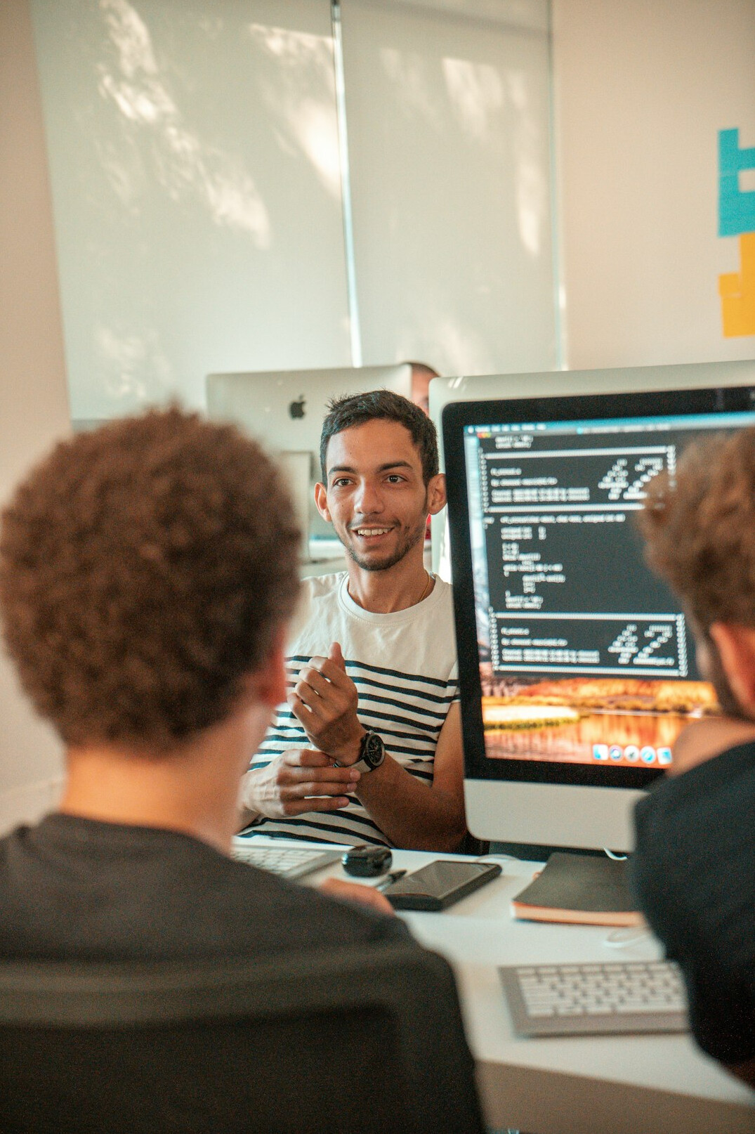 corporate team collaborating on code