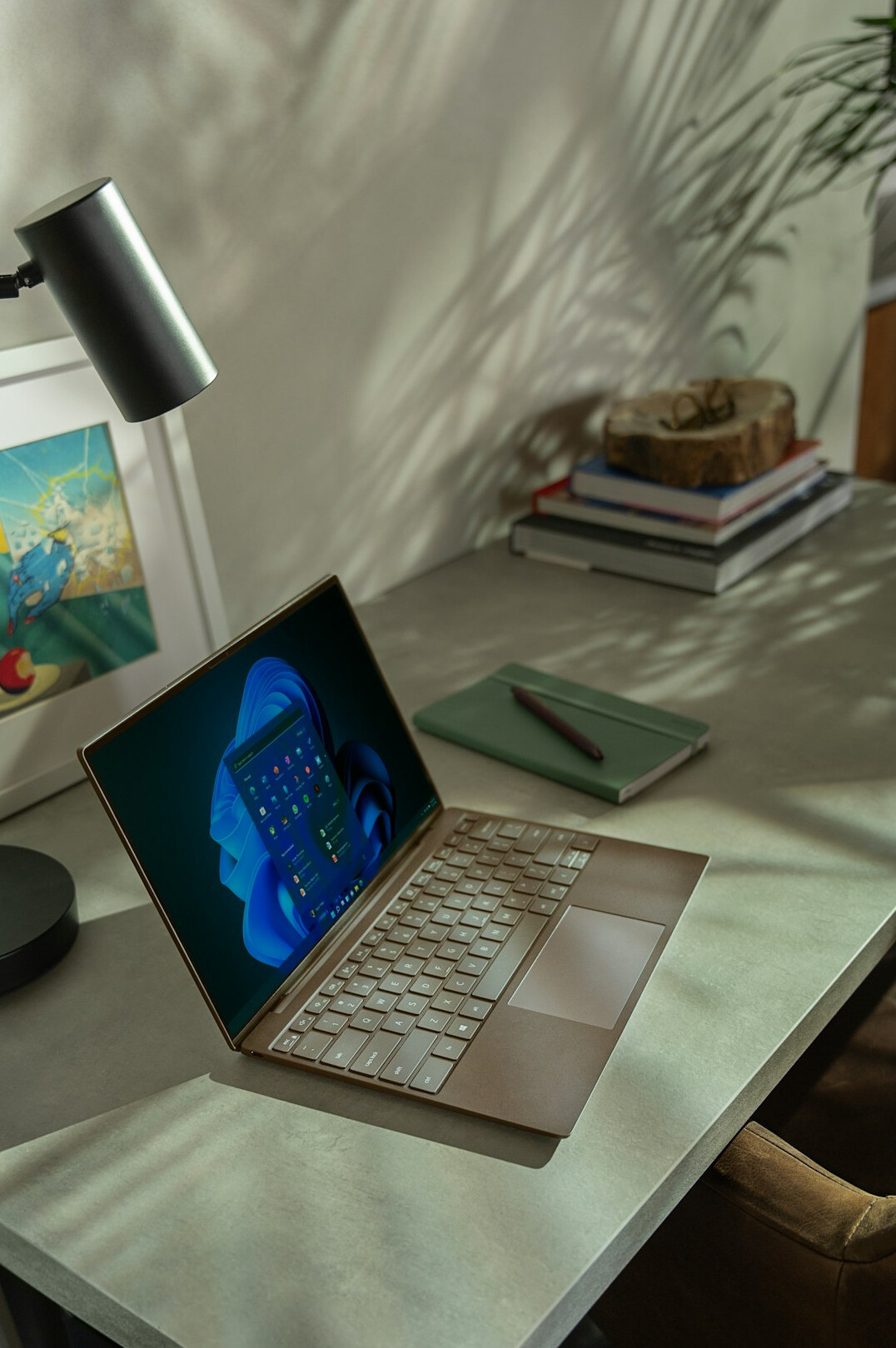 Laptop screen showing analytics charts and graphs on a desk