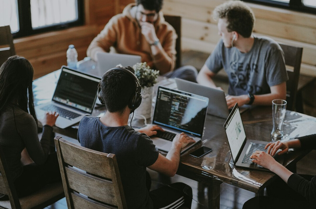 corporate team discussing software