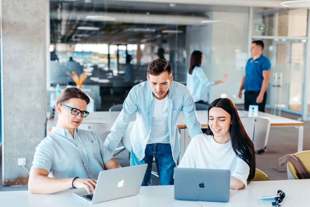 employees collaborating on computer